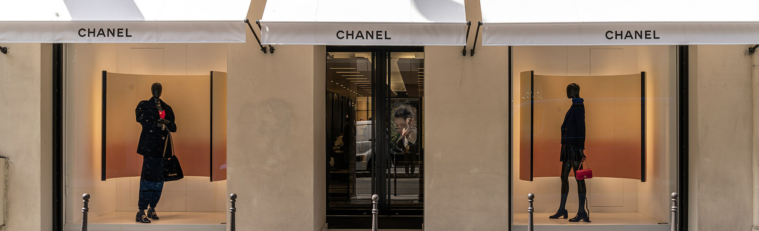 Front view with entrance and two shop windows of the Chanel flagship store on Rue Cambon in Paris.