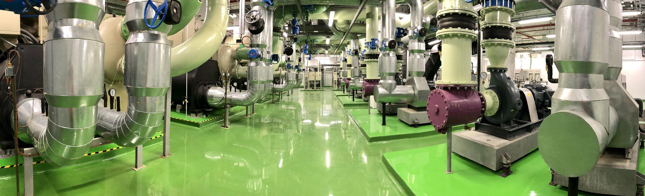 Several large machines in a technical centre on an industrial floor.