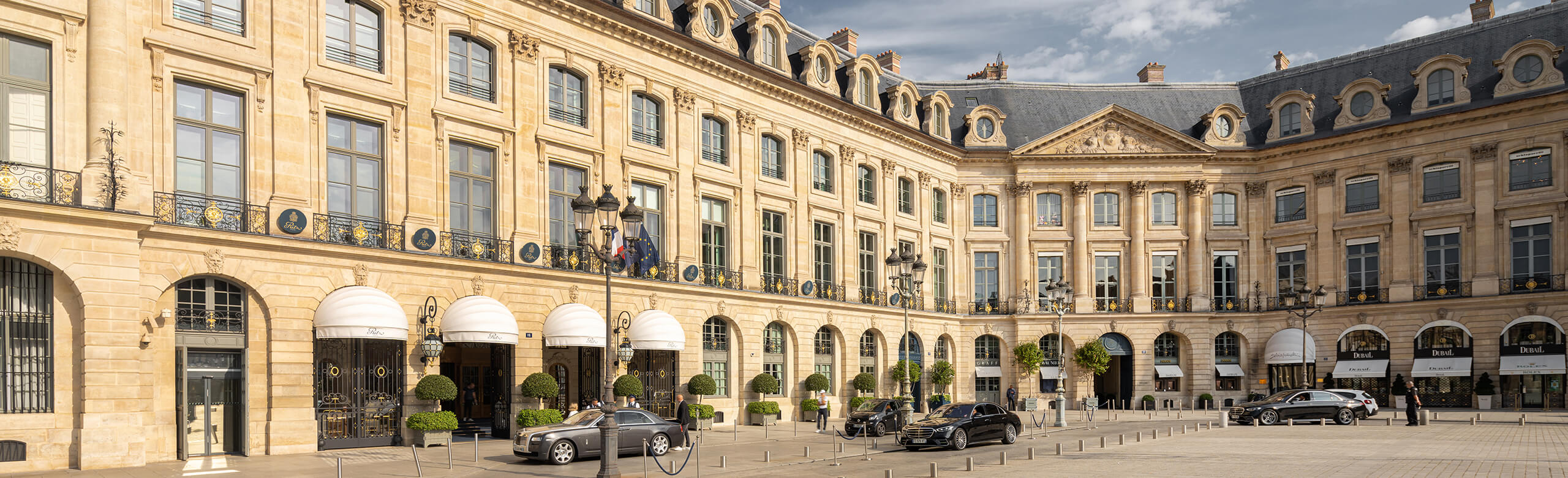 The prestigious Ritz Hotel in Paris with limousines on the forecourt.